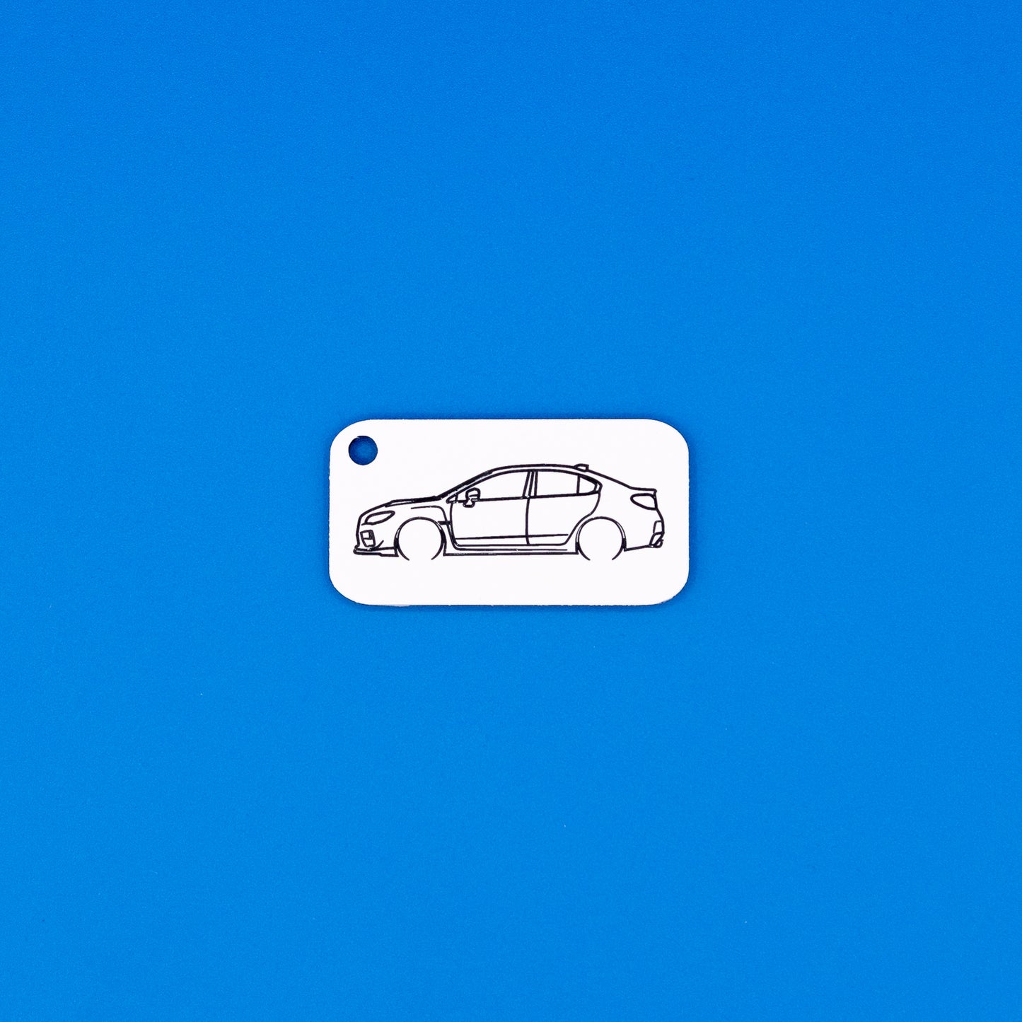 Subaru VA WRX Keychain on blue background