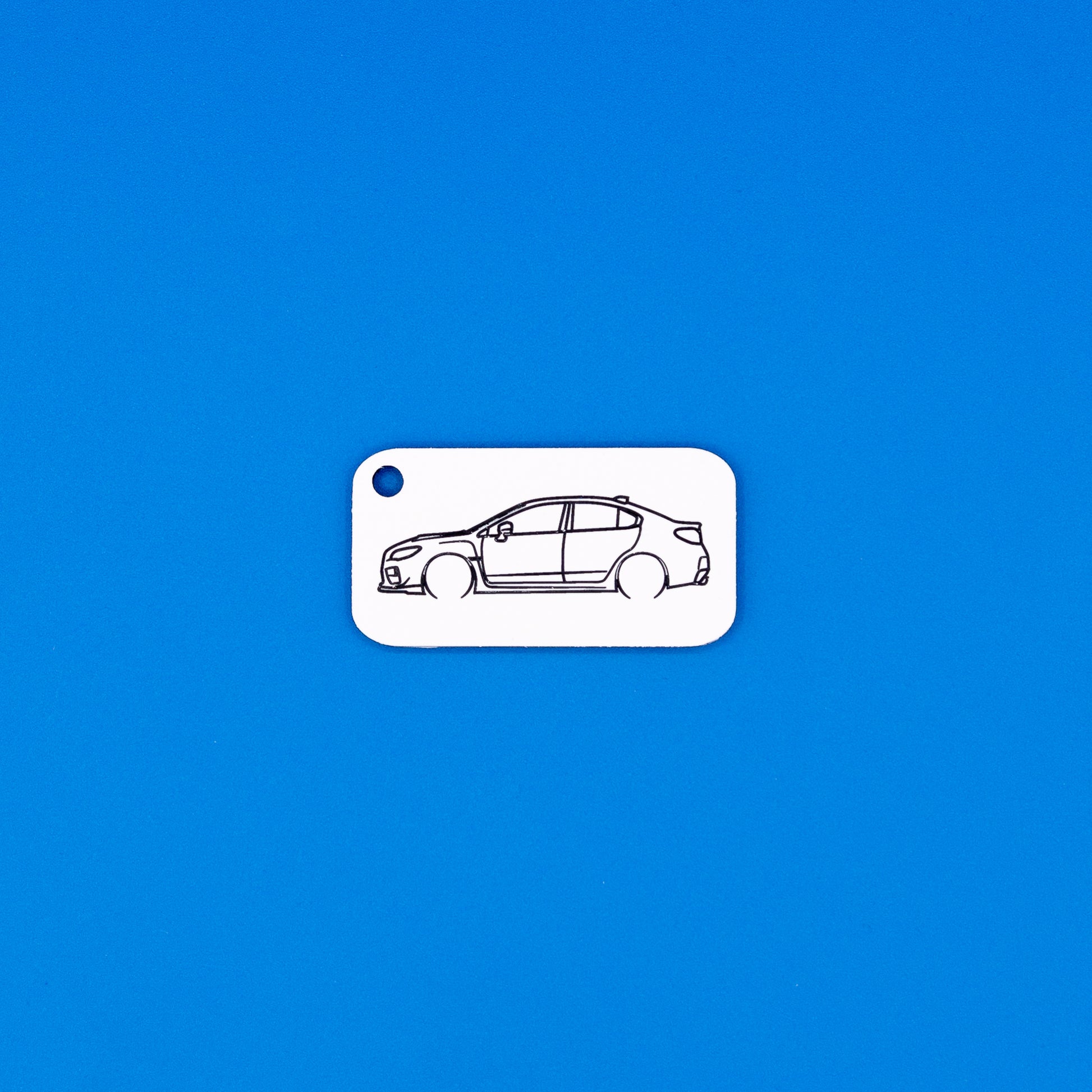 Subaru VA WRX Keychain on blue background