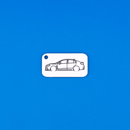 Subaru VA WRX Keychain on blue background