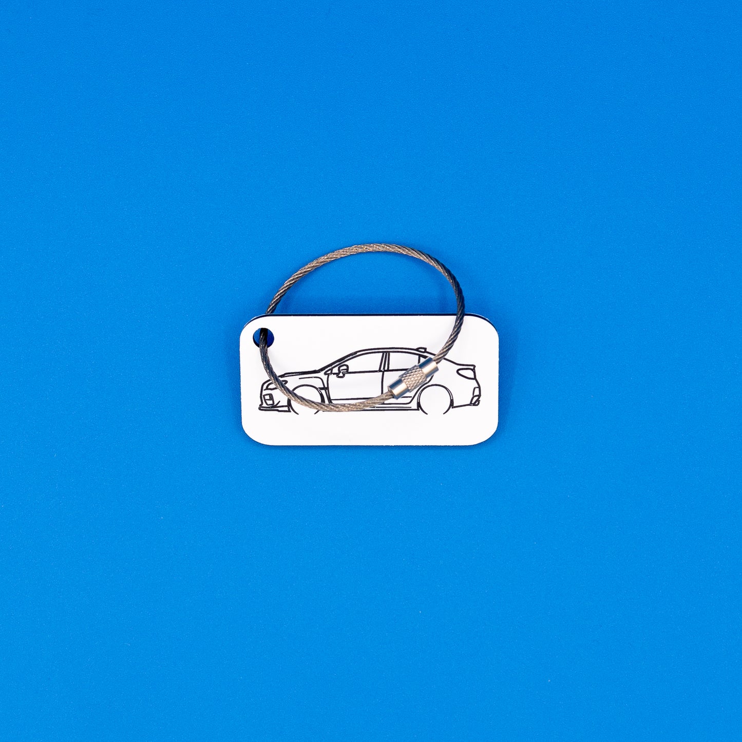 Subaru VA WRX Keychain with wire loop on blue background