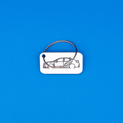 Subaru VA WRX Keychain with wire loop on blue background