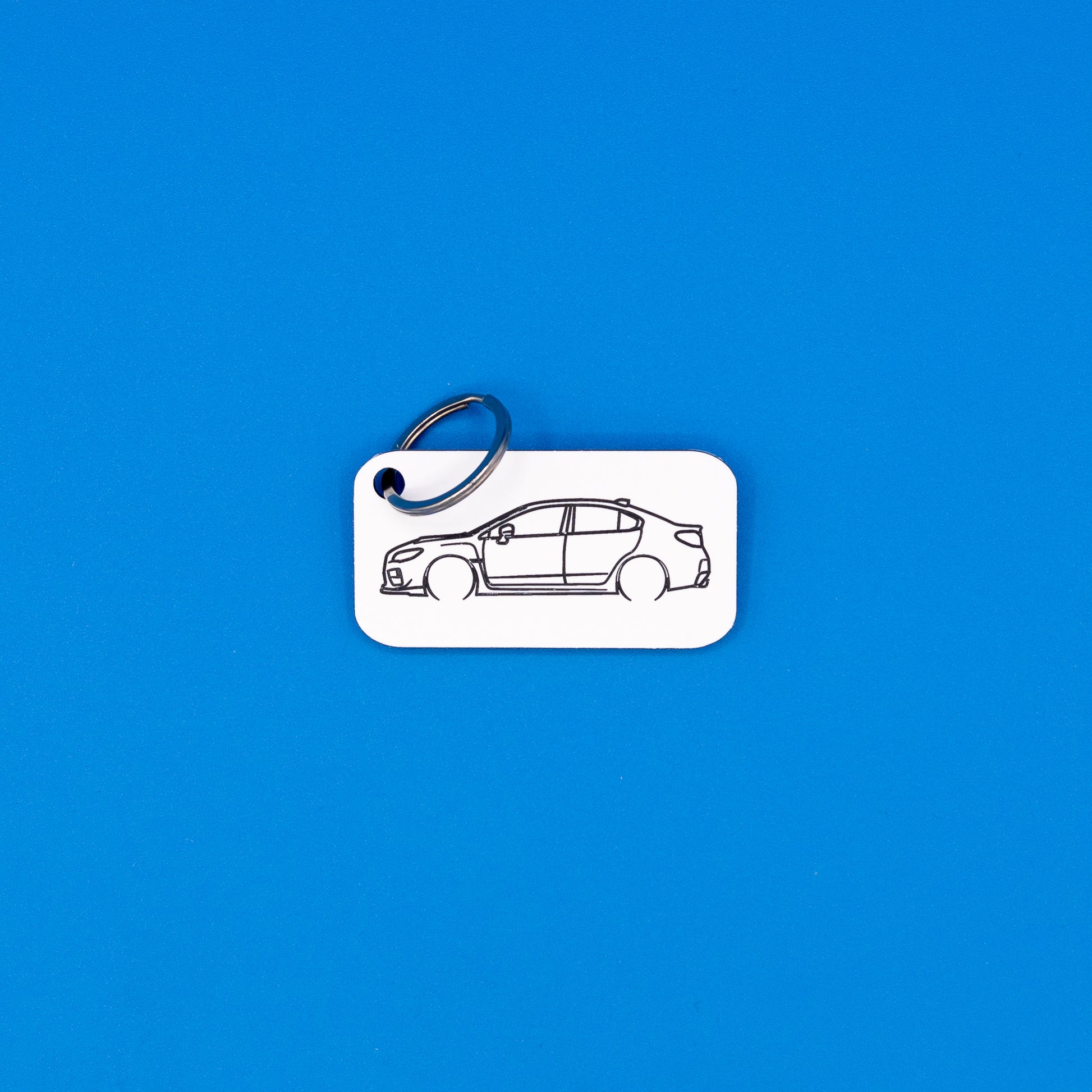 Subaru VA WRX Keychain with classic key ring on blue background