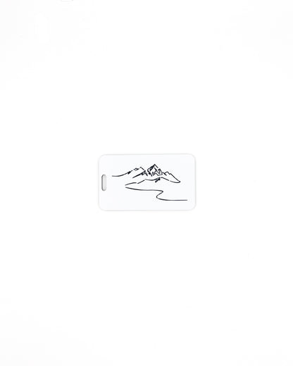 Mountain Design acrylic luggage tag in white.