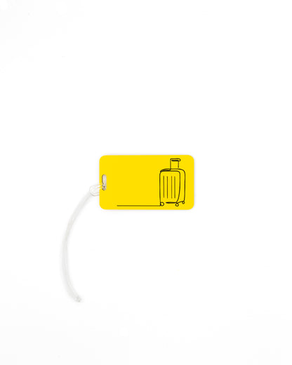 Mountain Design acrylic luggage tag in yellow with worm loop.