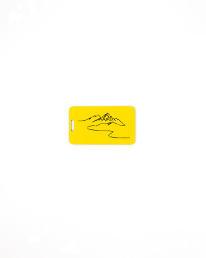 Mountain Design acrylic luggage tag in yellow.