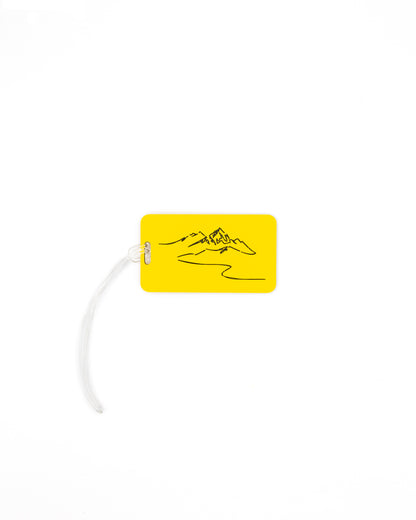 Mountain Design acrylic luggage tag in yellow with worm loop.