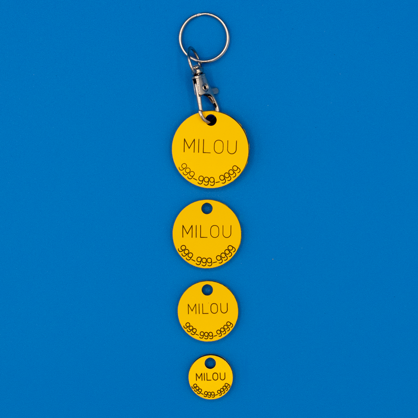 Circular Pet ID Tags in all sizes in yellow with strap. 