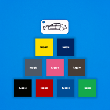 BMW F90 M5 keychain in white with color options on a blue background