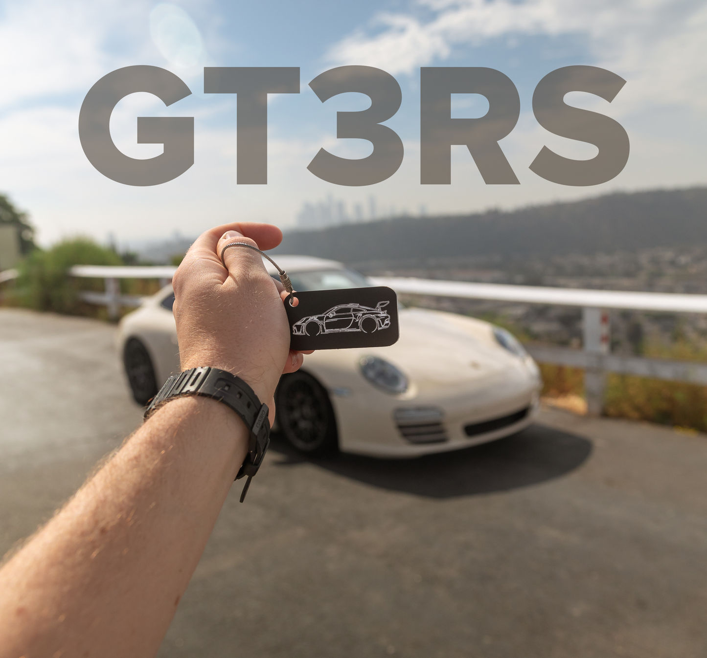 Picture of a Porsche 911 with a GT3rs Acrylic Keychain in chocolate.