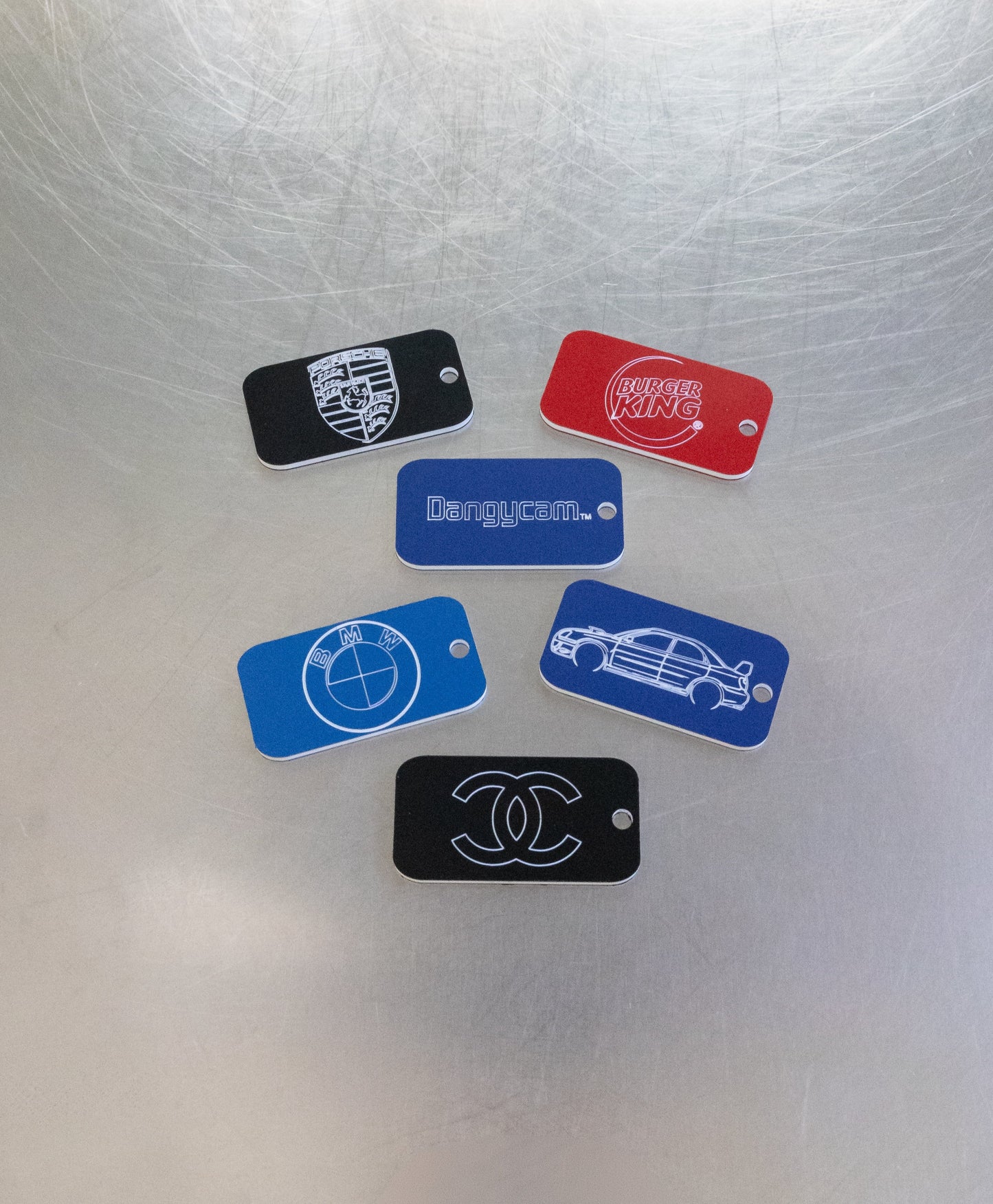 custom key tags with porsche bmw burger king and chanel logo