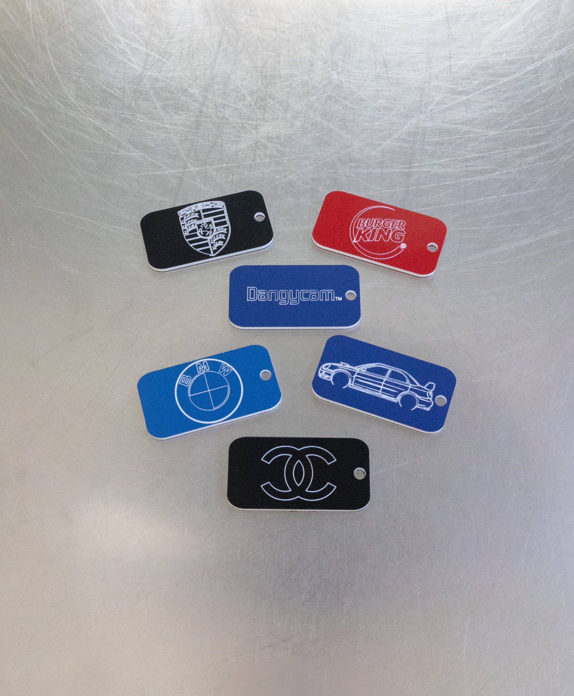 custom key tags with porsche bmw burger king and chanel logo