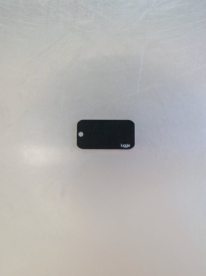 rear of custom key tag with luggie branding