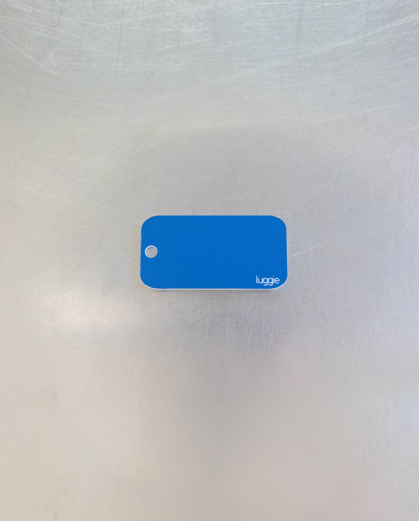 rear of light blue custom key tag 
