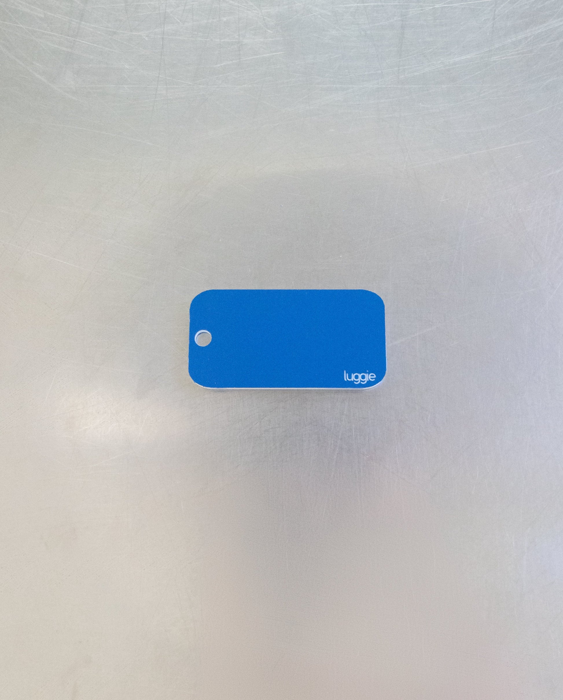 rear of light blue custom key tag 