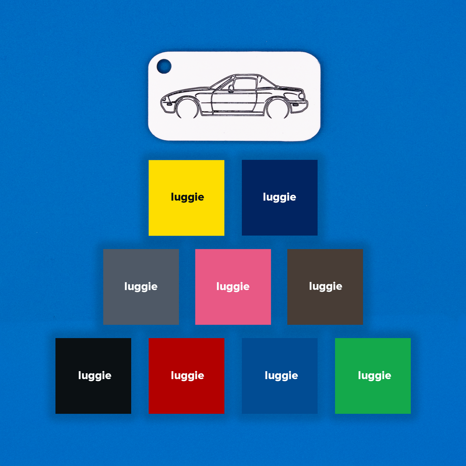 Mazda NA Miata Acrylic Keychain in white with just the hole showcasing nine other color options: yellow, dark blue, grey, pink, chocolate, light blue, red, black and spring green.