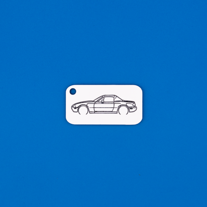 Mazda NA Miata Acrylic Keychain in white with just the hole. 