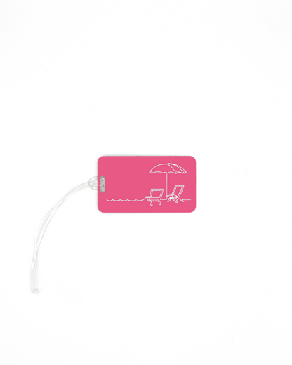 Beach design acrylic luggage tag with worm loop in pink.